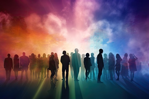 silhoueetes of people backlit against a rainbow sky