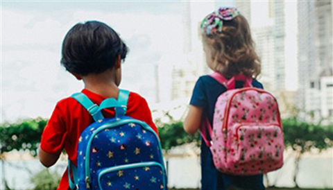 Two Kids Wearing Backpacks